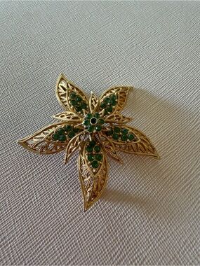 MCM Corocraft Gold-Tone Floral Brooch with Green Rhinestones